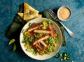 BBQ SCHNITZEL & SALAD NACHO BOWL